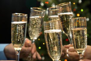 Image of people hands with crystal glasses full of champagne